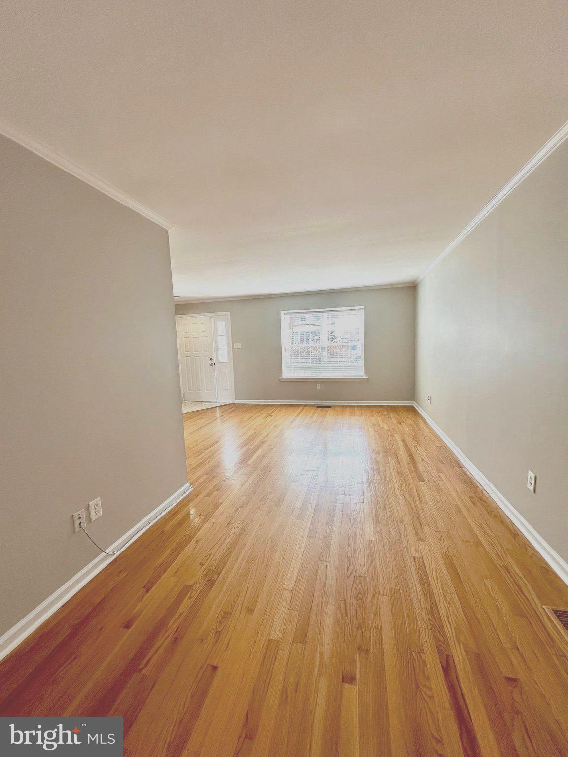 41 Victoria Drive Aston, PA 19014 - Photo 9 of 19 an empty room with wooden floor and windows