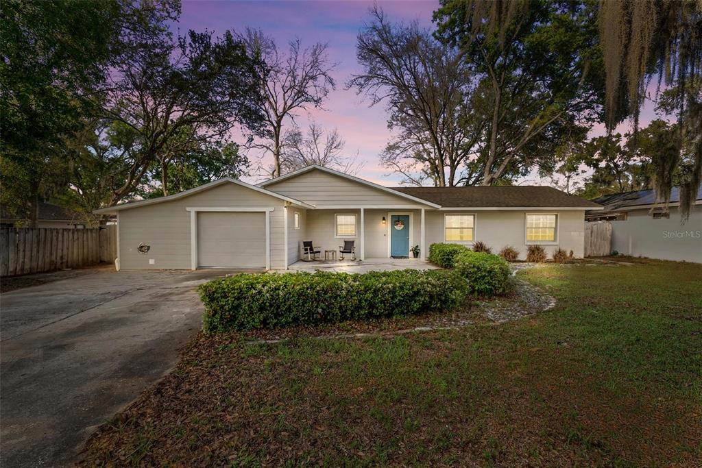 106 Portland Street Eustis, FL 32726 - Photo 1 of 71 a front view of a house with garden