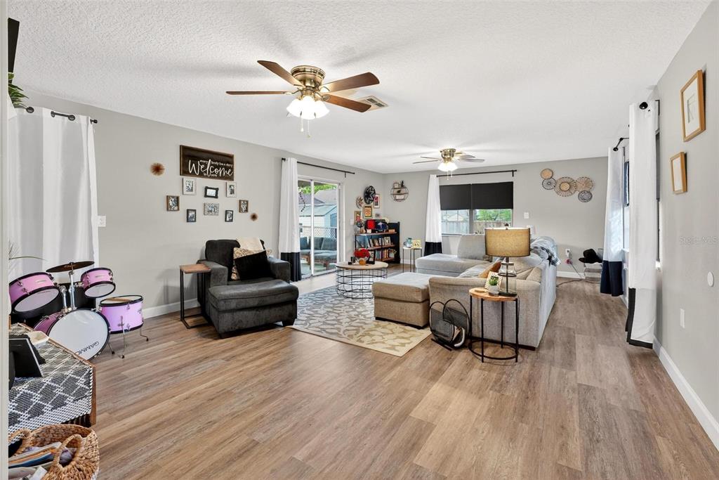106 Portland Street Eustis, FL 32726 - Photo 30 of 71 a living room with furniture and wooden floor
