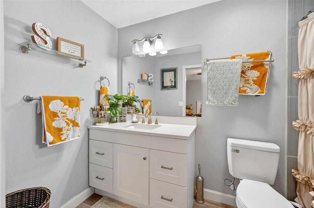 106 Portland Street Eustis, FL 32726 - Photo 50 of 71 a bathroom with a toilet sink and mirror