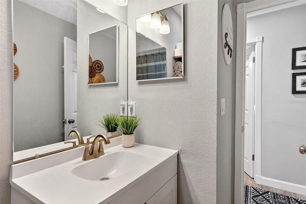 106 Portland Street Eustis, FL 32726 - Photo 54 of 71 a bathroom with a sink and a mirror