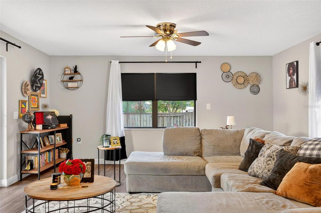 106 Portland Street Eustis, FL 32726 - Photo 10 of 71 a living room with furniture chandelier and a window