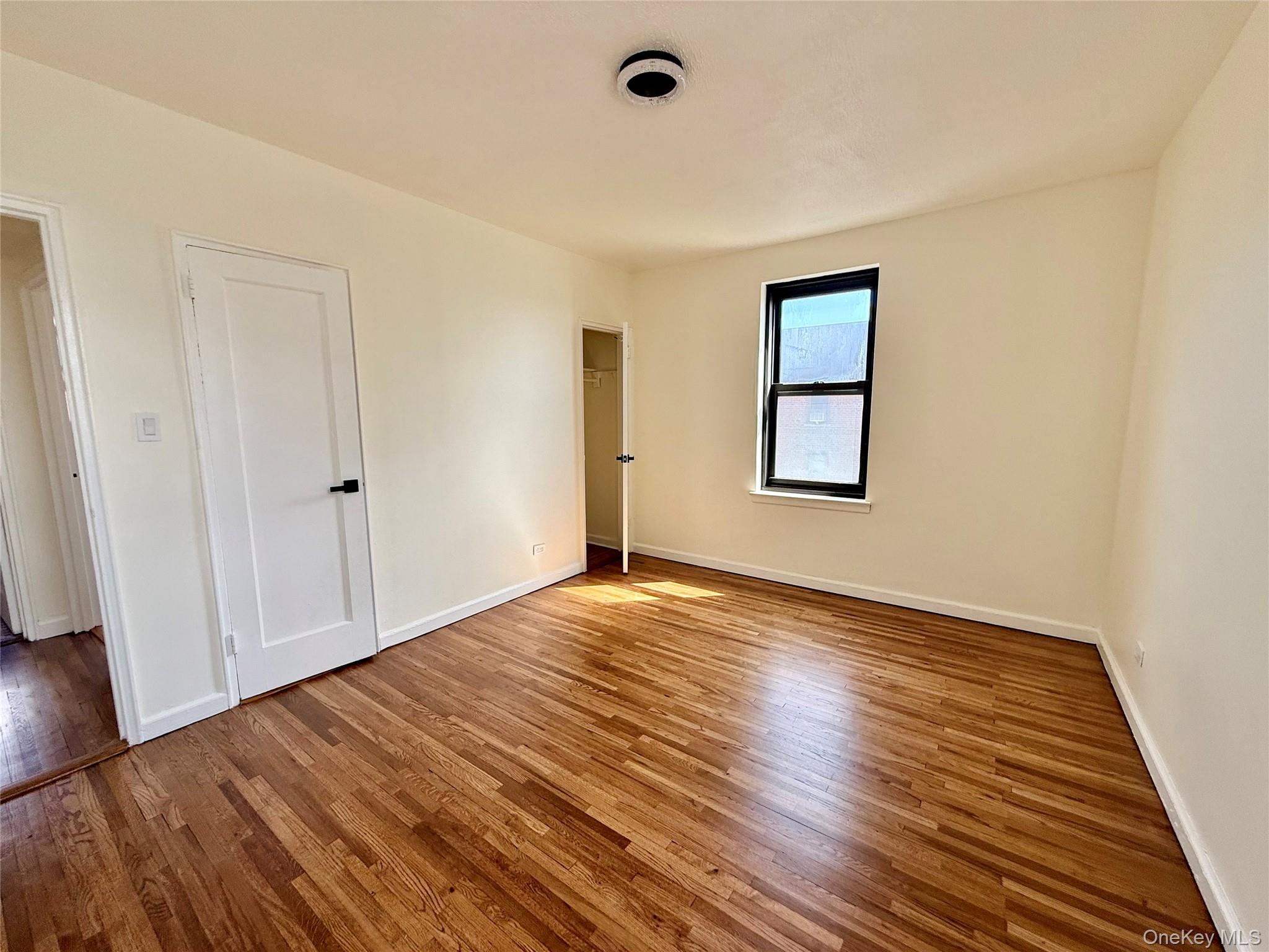 112-25 34th Avenue, Unit 6H Queens, NY 11368 - Photo 17 of 48 Corner bedroom with 2 opposite side windows, 2 closets. Ceiling light, hardwood floors. Great view of Cityfield