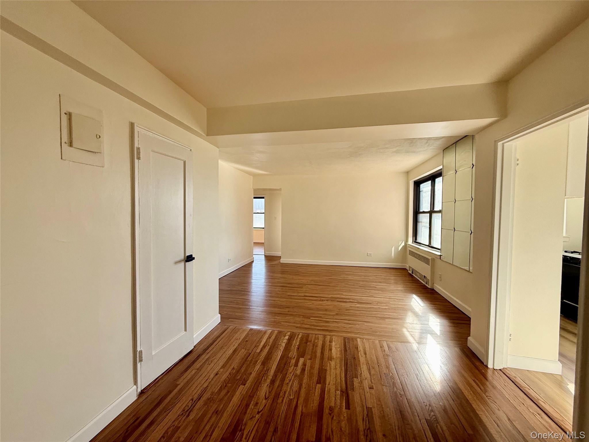 112-25 34th Avenue, Unit 6H Queens, NY 11368 - Photo 7 of 48 Open to the living area, large coat closet, ceiling light, hardwood floors