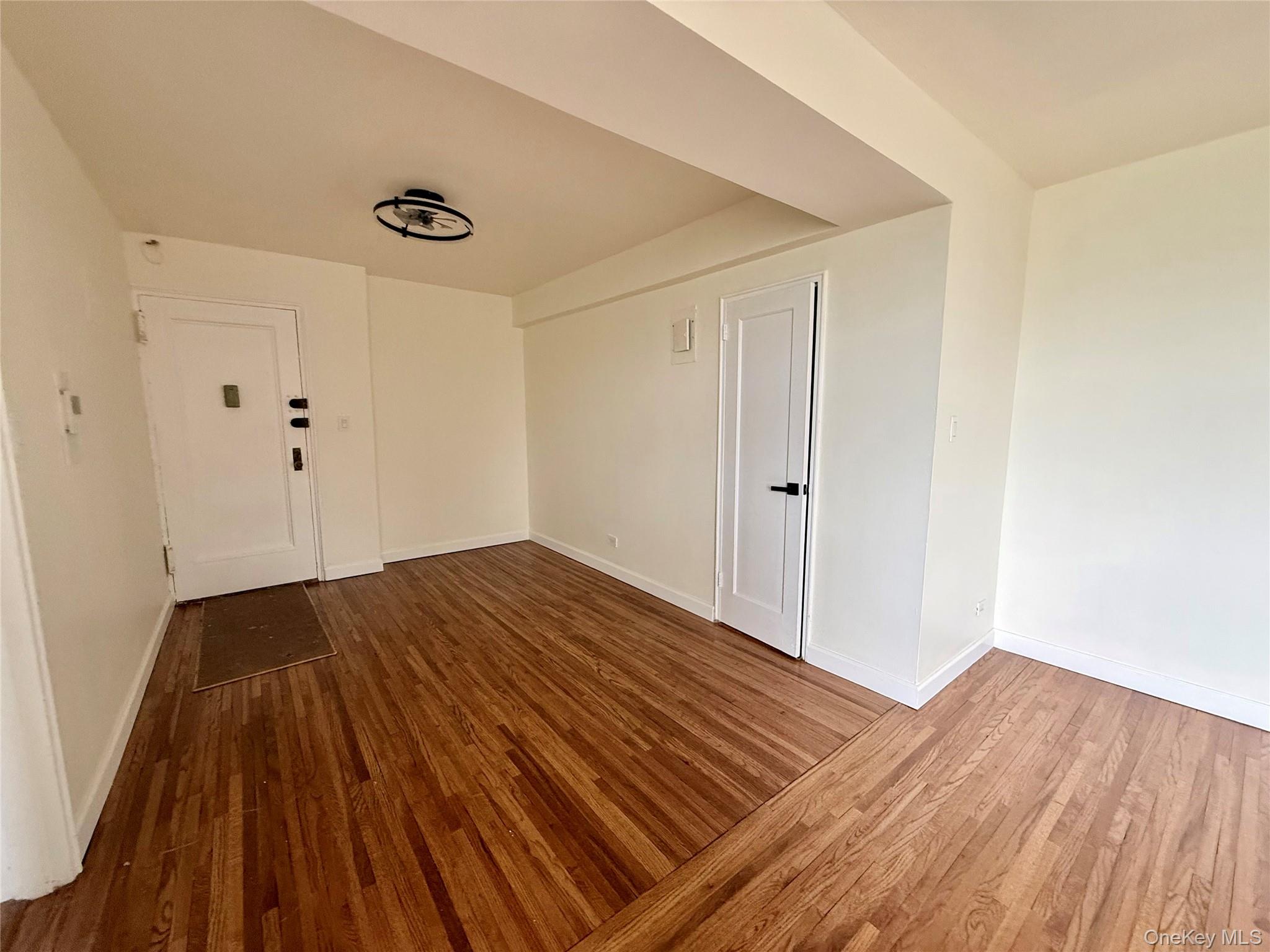 112-25 34th Avenue, Unit 6H Queens, NY 11368 - Photo 8 of 48 Open to the living area, large coat closet, ceiling light, hardwood floors