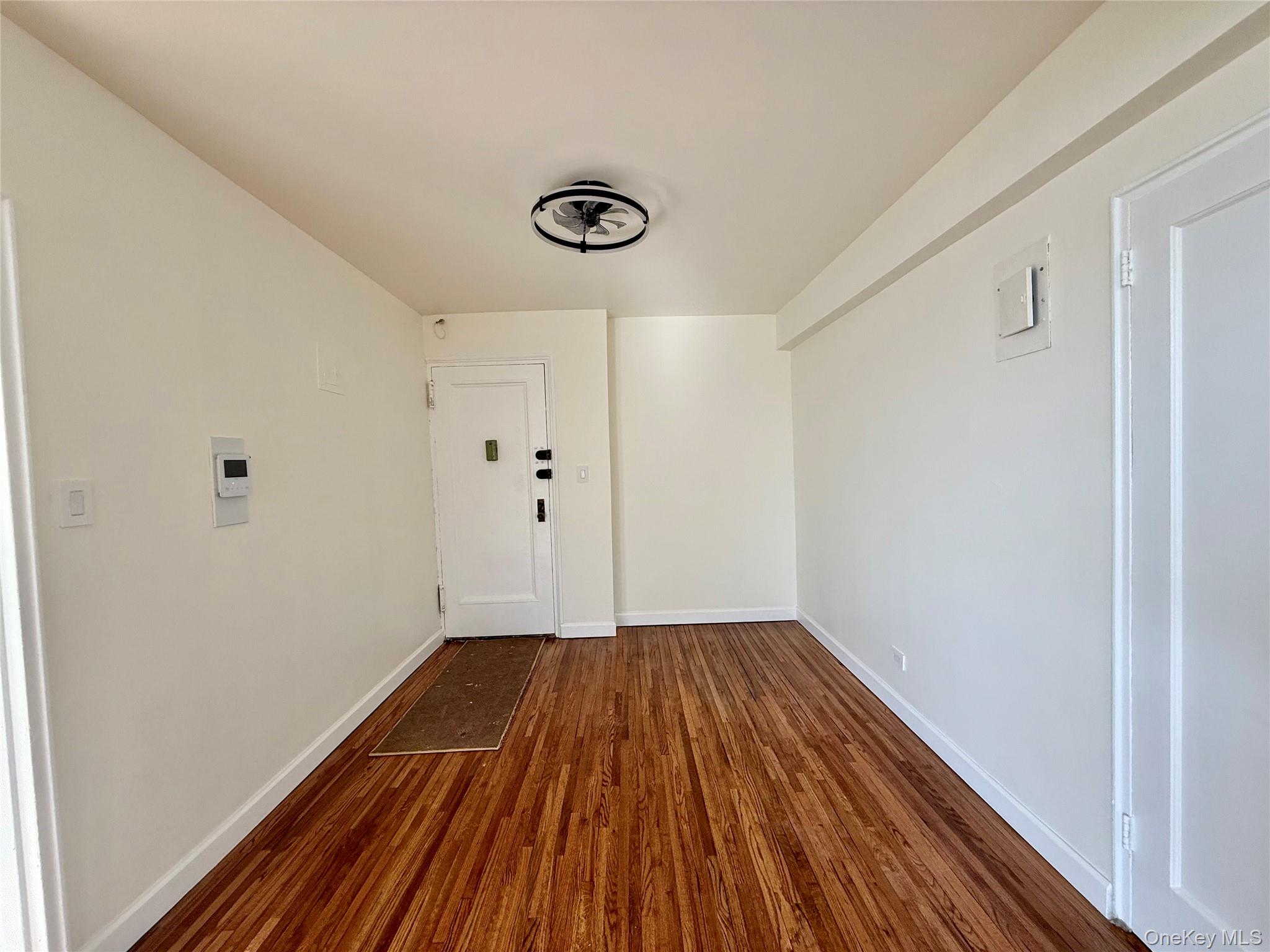 112-25 34th Avenue, Unit 6H Queens, NY 11368 - Photo 9 of 48 Open to the living area, large coat closet, ceiling light, hardwood floors