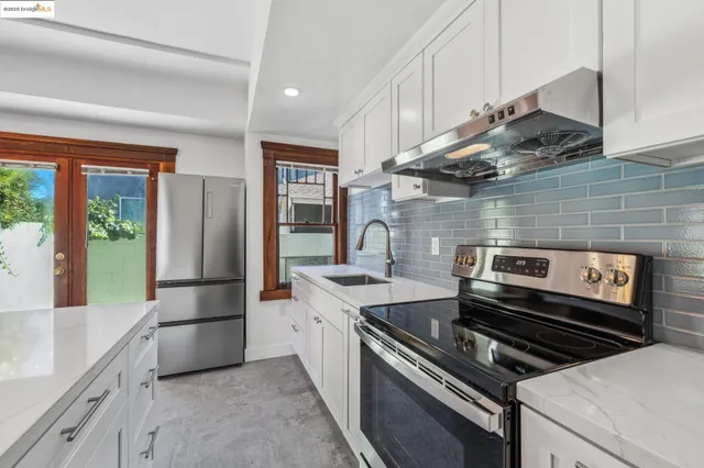 a kitchen with a stove and a refrigerator