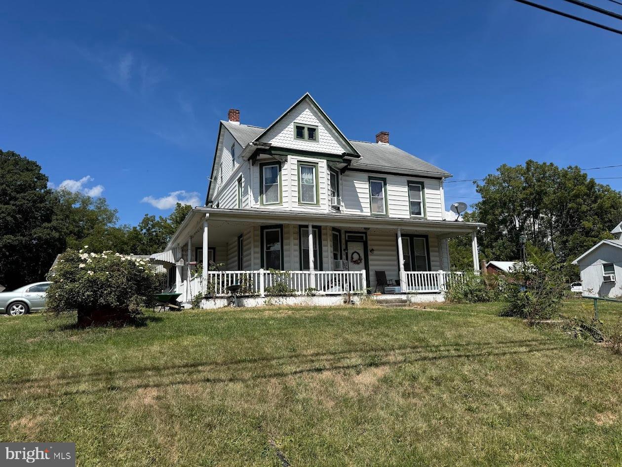 2691 Emmitsburg Road Gettysburg, PA 17325 - Photo 1 of 4 a front view of a house with a garden and trees