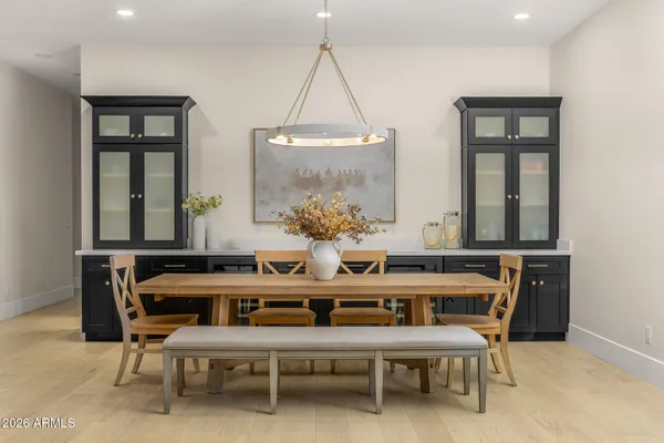 a dining room with furniture and window