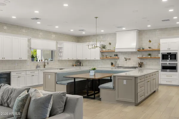 a kitchen with stainless steel appliances granite countertop a sink and cabinets