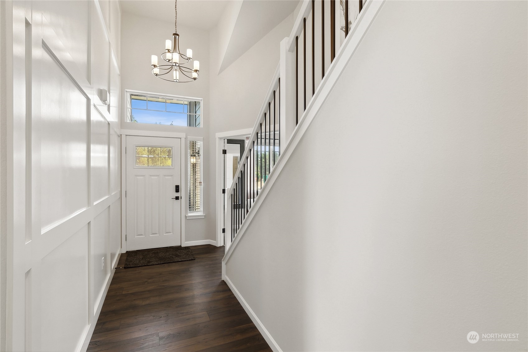 3016 Stephanie Loop Northeast Lacey, WA 98516 - Photo 2 of 19 a view of a hallway with wooden floor and staircase