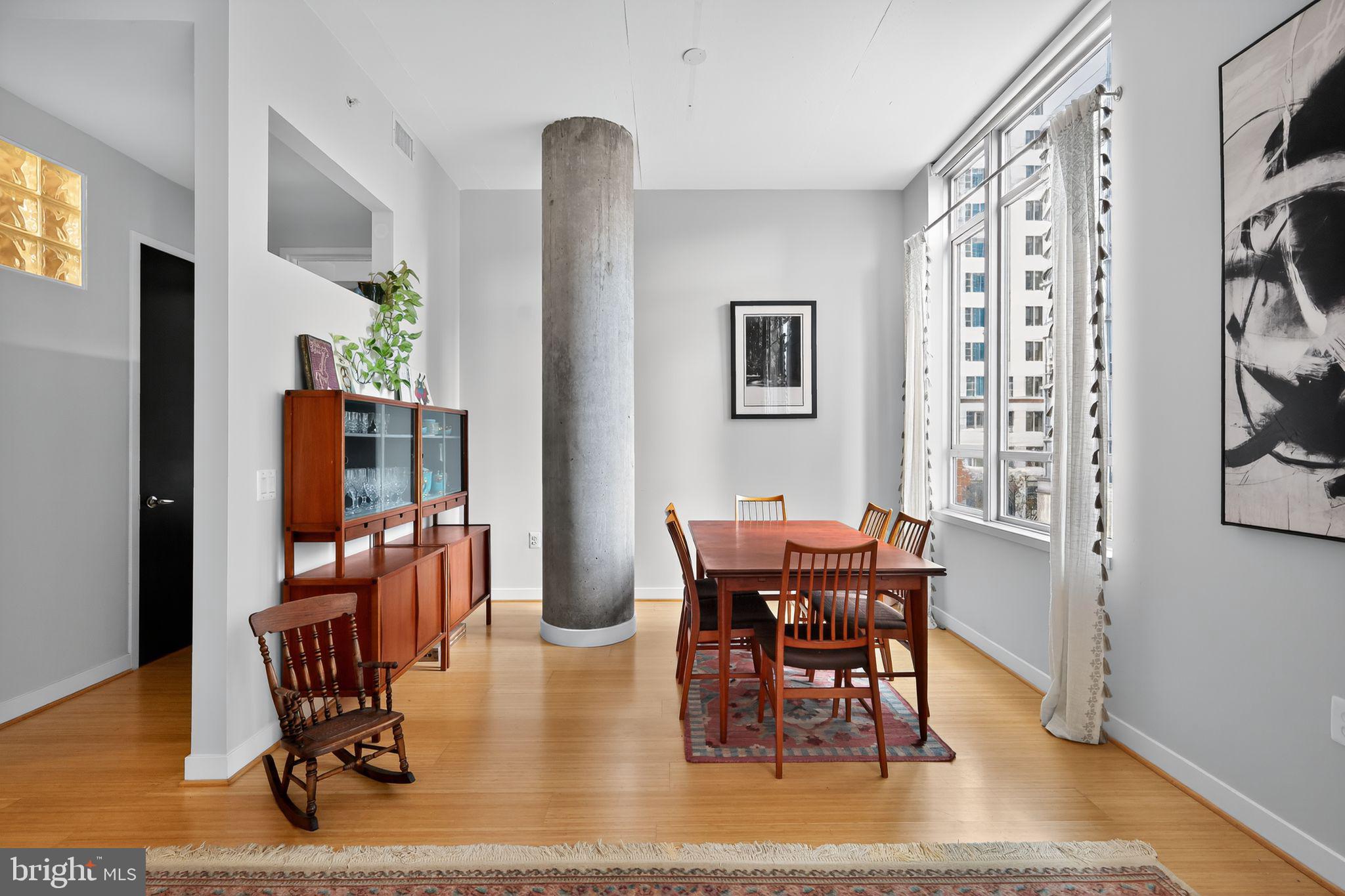 12025 New Dominion Parkway, Unit 311 Reston, VA 20190 - Photo 11 of 29 a view of a dining room with furniture and chandelier