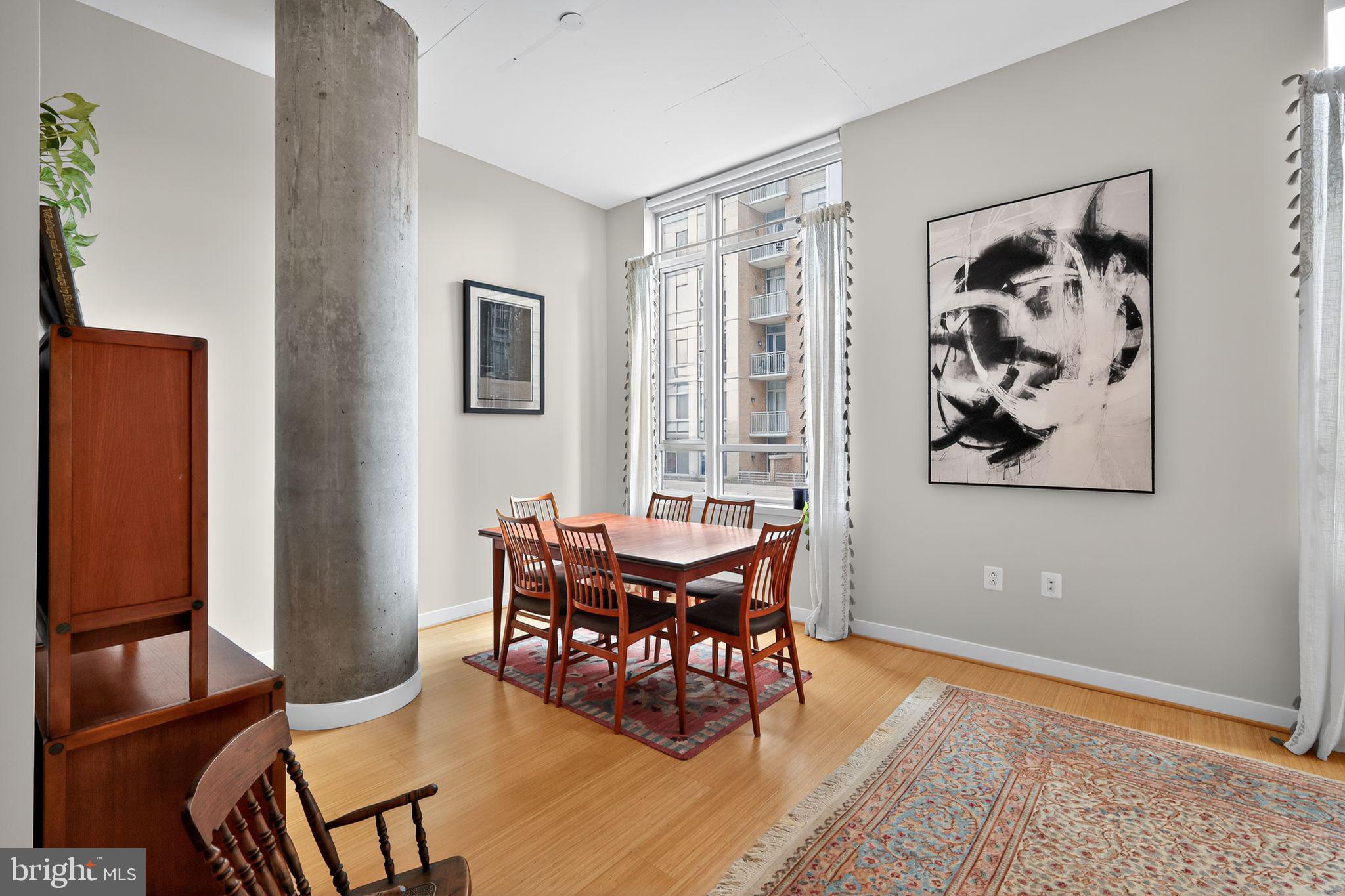 12025 New Dominion Parkway, Unit 311 Reston, VA 20190 - Photo 12 of 29 a dining room with furniture and window