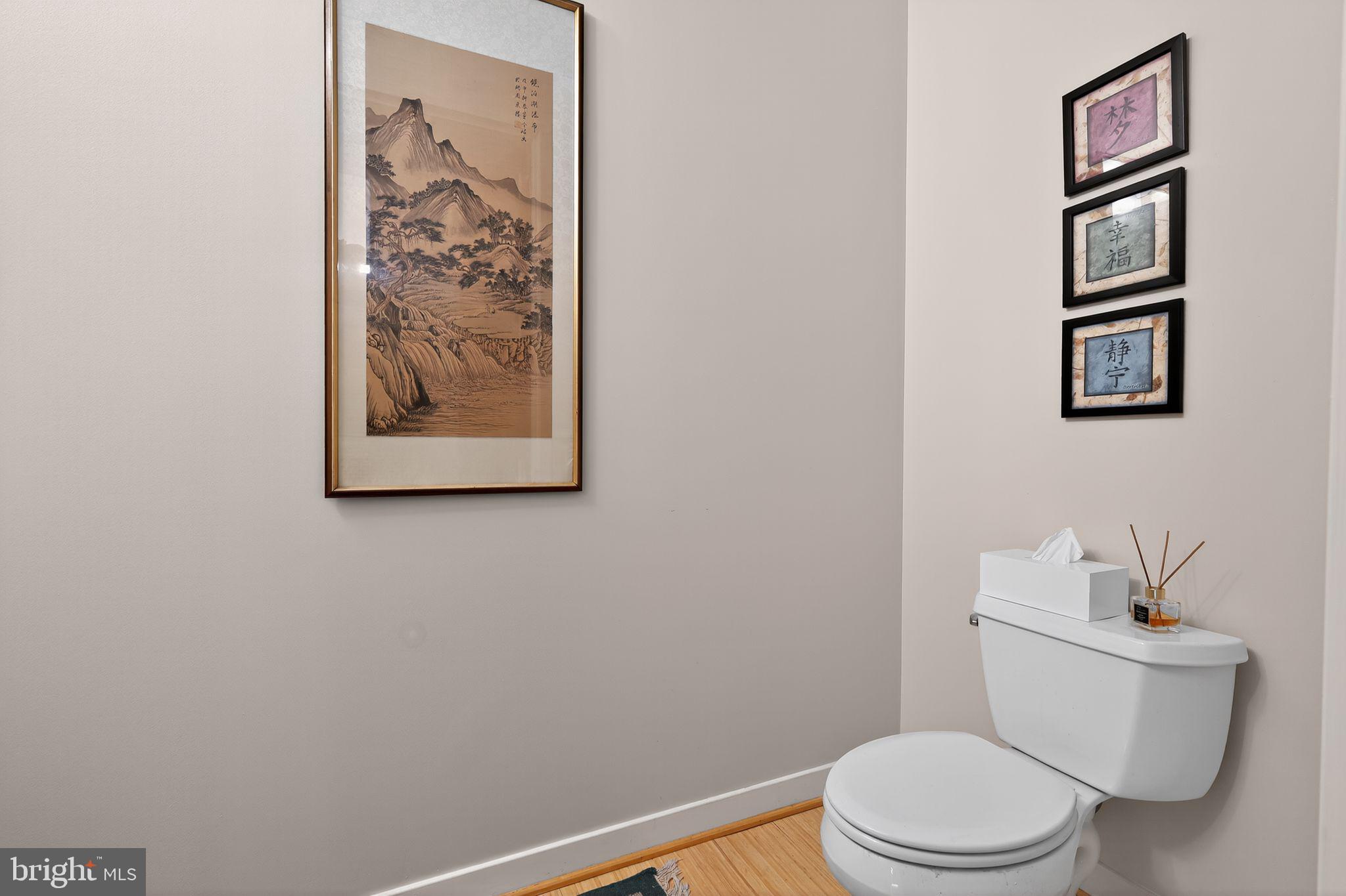 12025 New Dominion Parkway, Unit 311 Reston, VA 20190 - Photo 18 of 29 a white toilet sitting next to a bathroom sink