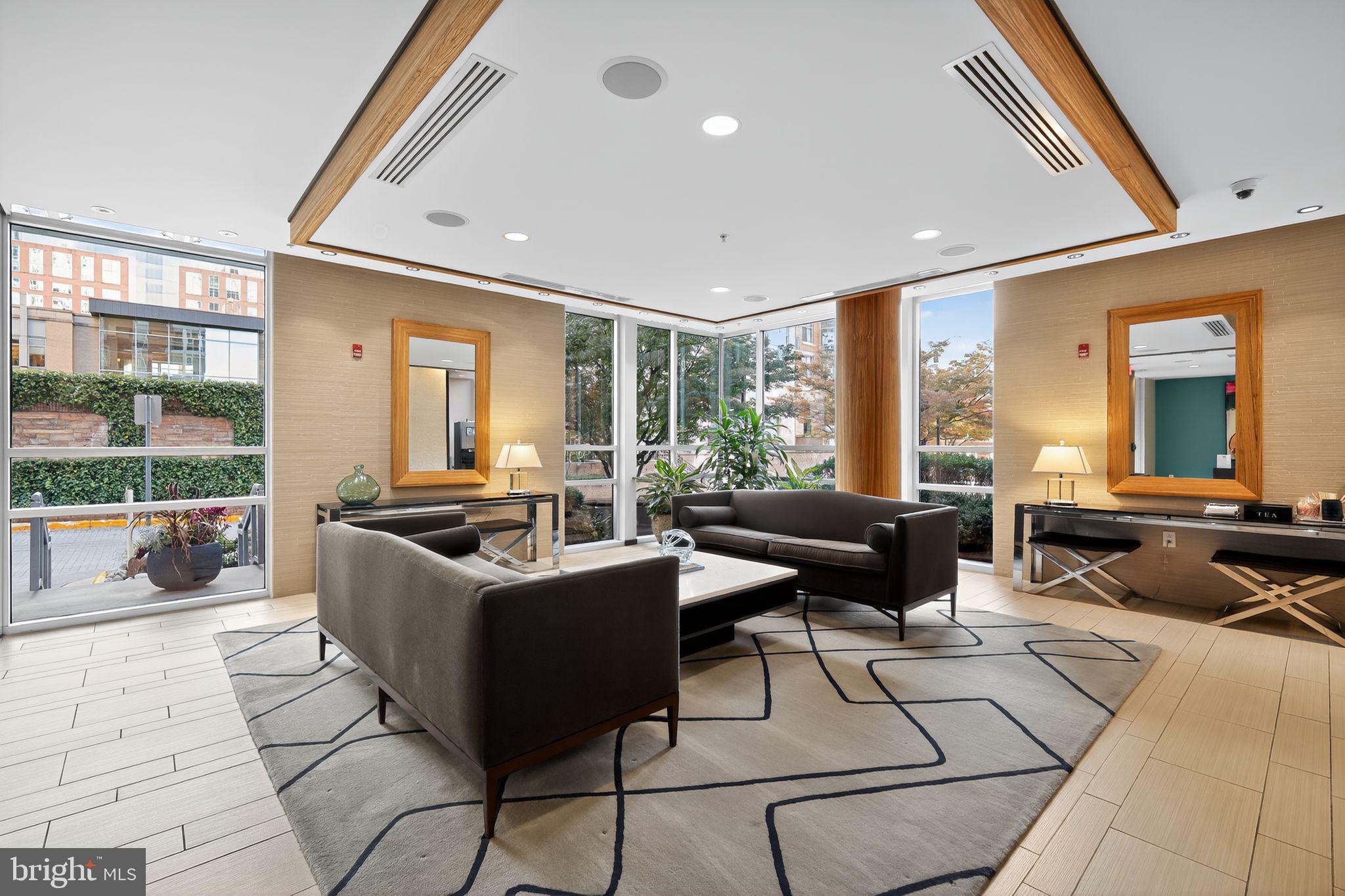12025 New Dominion Parkway, Unit 311 Reston, VA 20190 - Photo 25 of 29 a living room with patio furniture and a large window