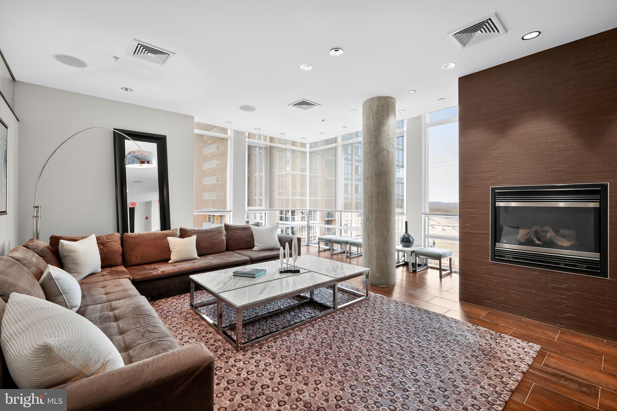 12025 New Dominion Parkway, Unit 311 Reston, VA 20190 - Photo 26 of 29 a living room with furniture rug and window