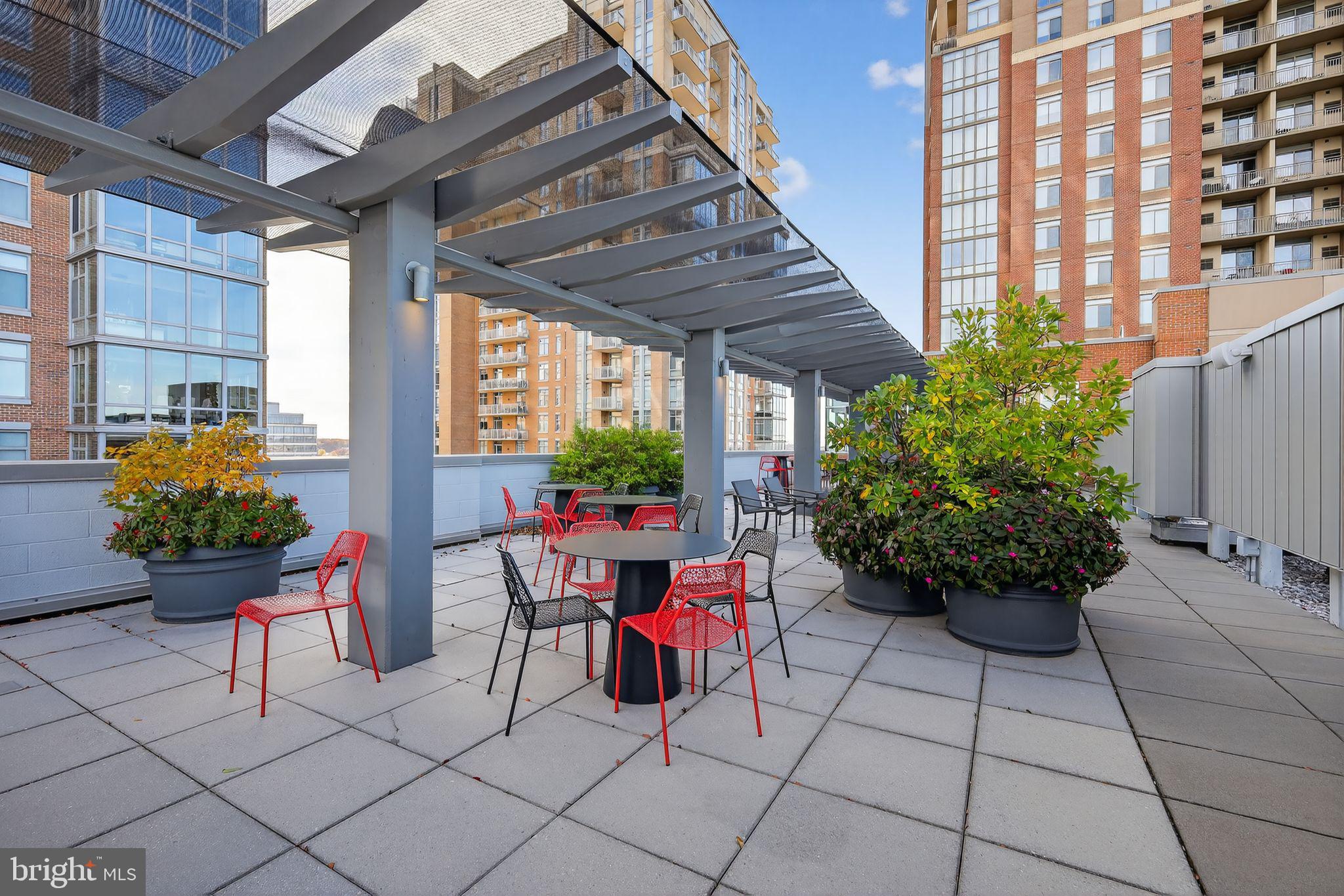 12025 New Dominion Parkway, Unit 311 Reston, VA 20190 - Photo 4 of 29 a view of a chairs and table in a patio