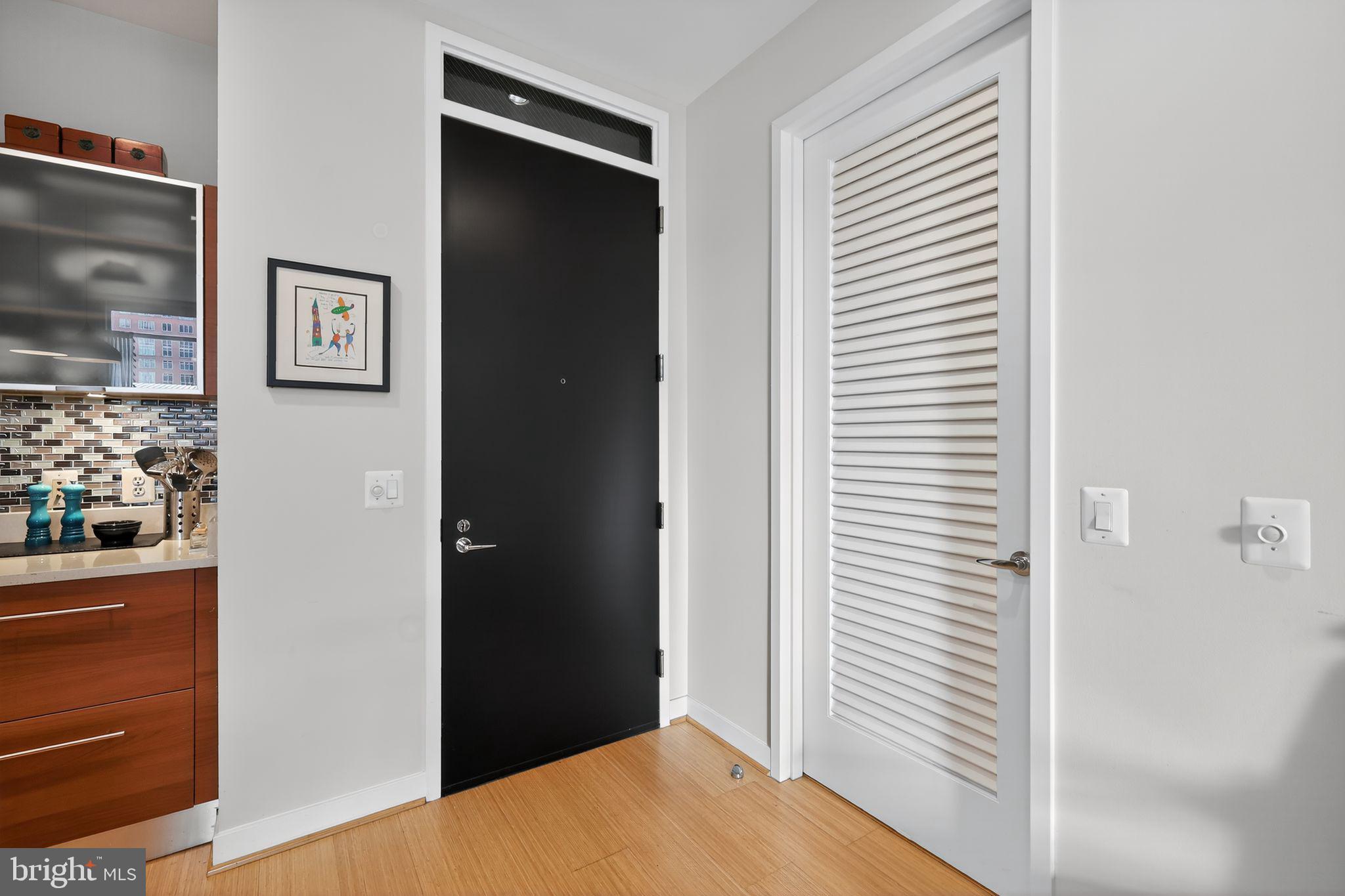 12025 New Dominion Parkway, Unit 311 Reston, VA 20190 - Photo 5 of 29 a view of a hallway with front door