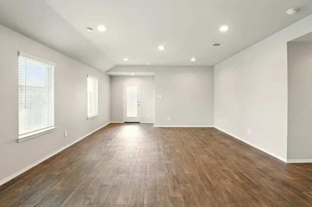 a view of a kitchen with a sink and a refrigerator