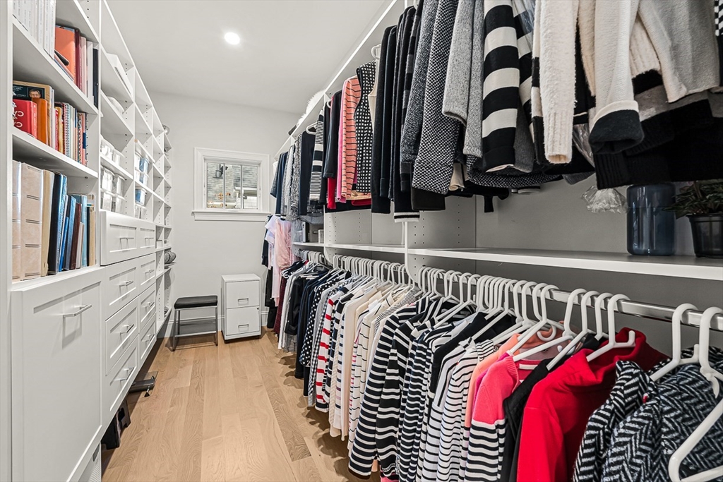 5 Peakes Lane, Unit 5 Weston, MA 02493 - Photo 14 of 32 a view of walk in closet with clothes and shoes
