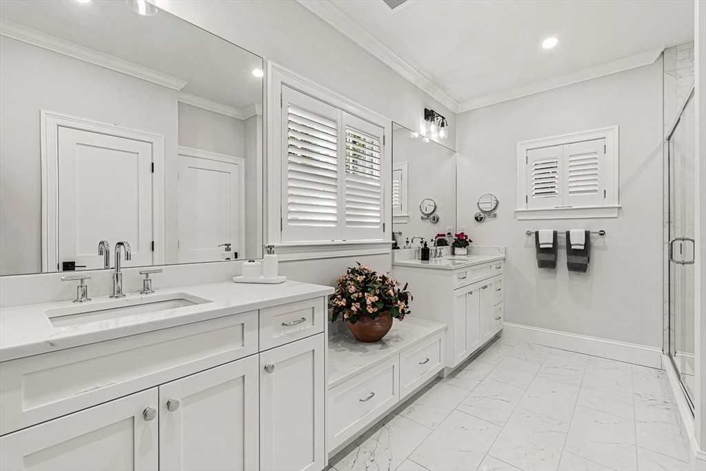 5 Peakes Lane, Unit 5 Weston, MA 02493 - Photo 15 of 32 a bathroom with a double vanity sink window and flower