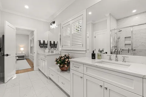 a bathroom with a sink double vanity and a mirror