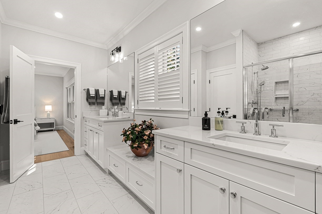 5 Peakes Lane, Unit 5 Weston, MA 02493 - Photo 17 of 32 a bathroom with a sink double vanity and a mirror