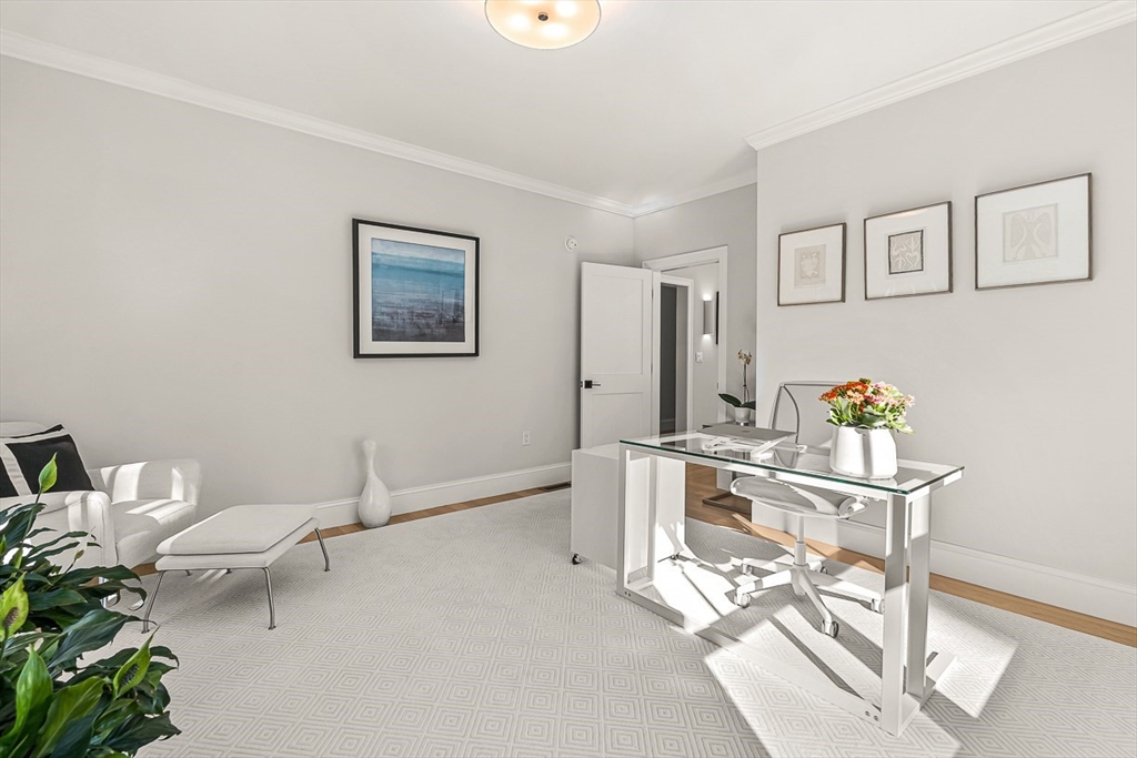 5 Peakes Lane, Unit 5 Weston, MA 02493 - Photo 18 of 32 a view of a workspace with furniture and wooden floor