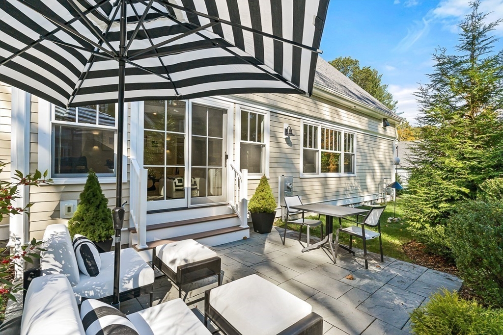 5 Peakes Lane, Unit 5 Weston, MA 02493 - Photo 32 of 32 a view of a patio with couple of chairs and a potted plant