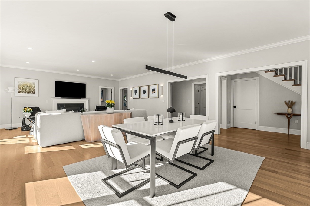 5 Peakes Lane, Unit 5 Weston, MA 02493 - Photo 9 of 32 a living room with furniture and a flat screen tv