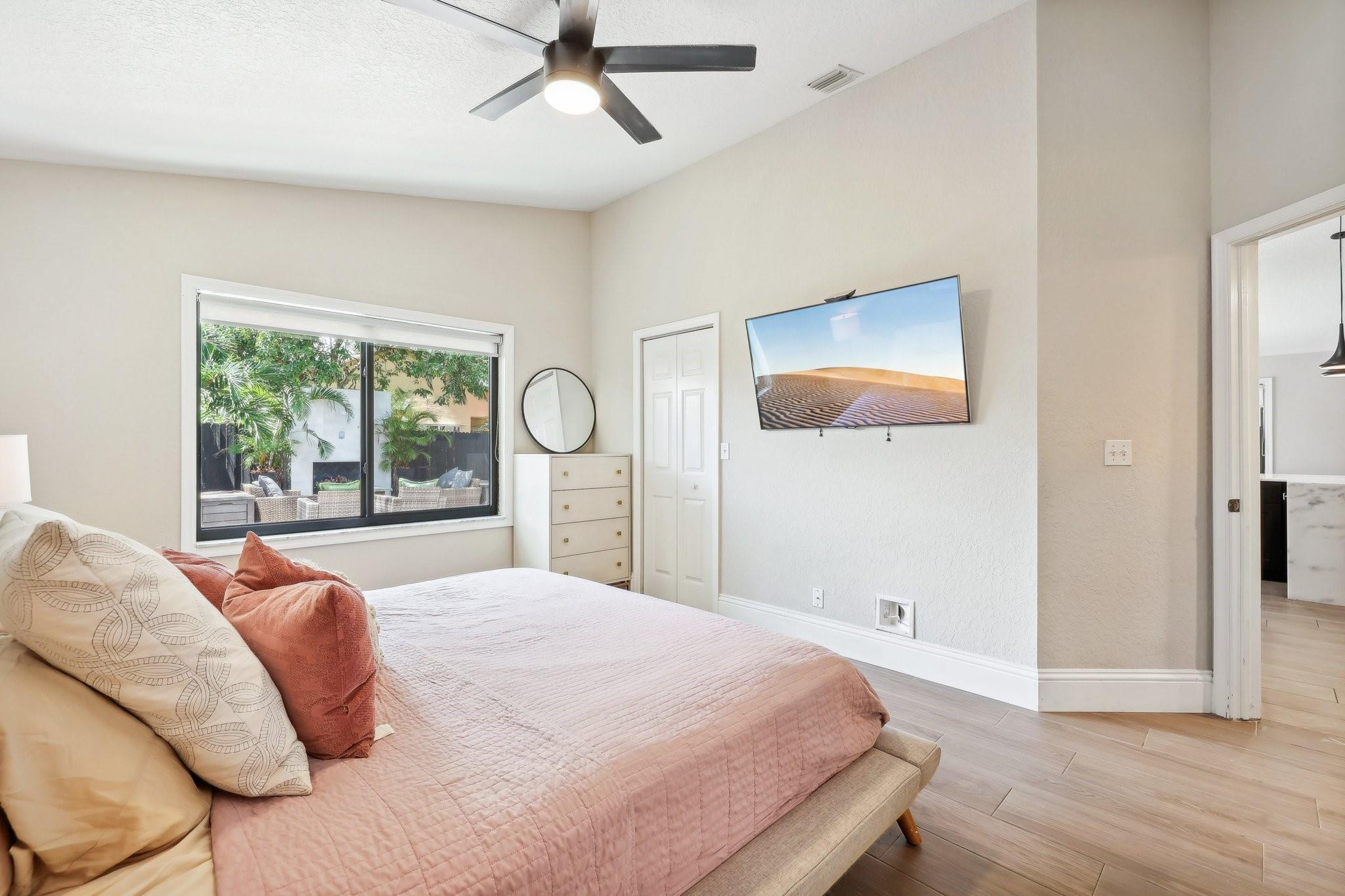 4035 Sabal Lakes Road Delray Beach, FL 33445 - Photo 20 of 43 a bedroom with a bed and a large window