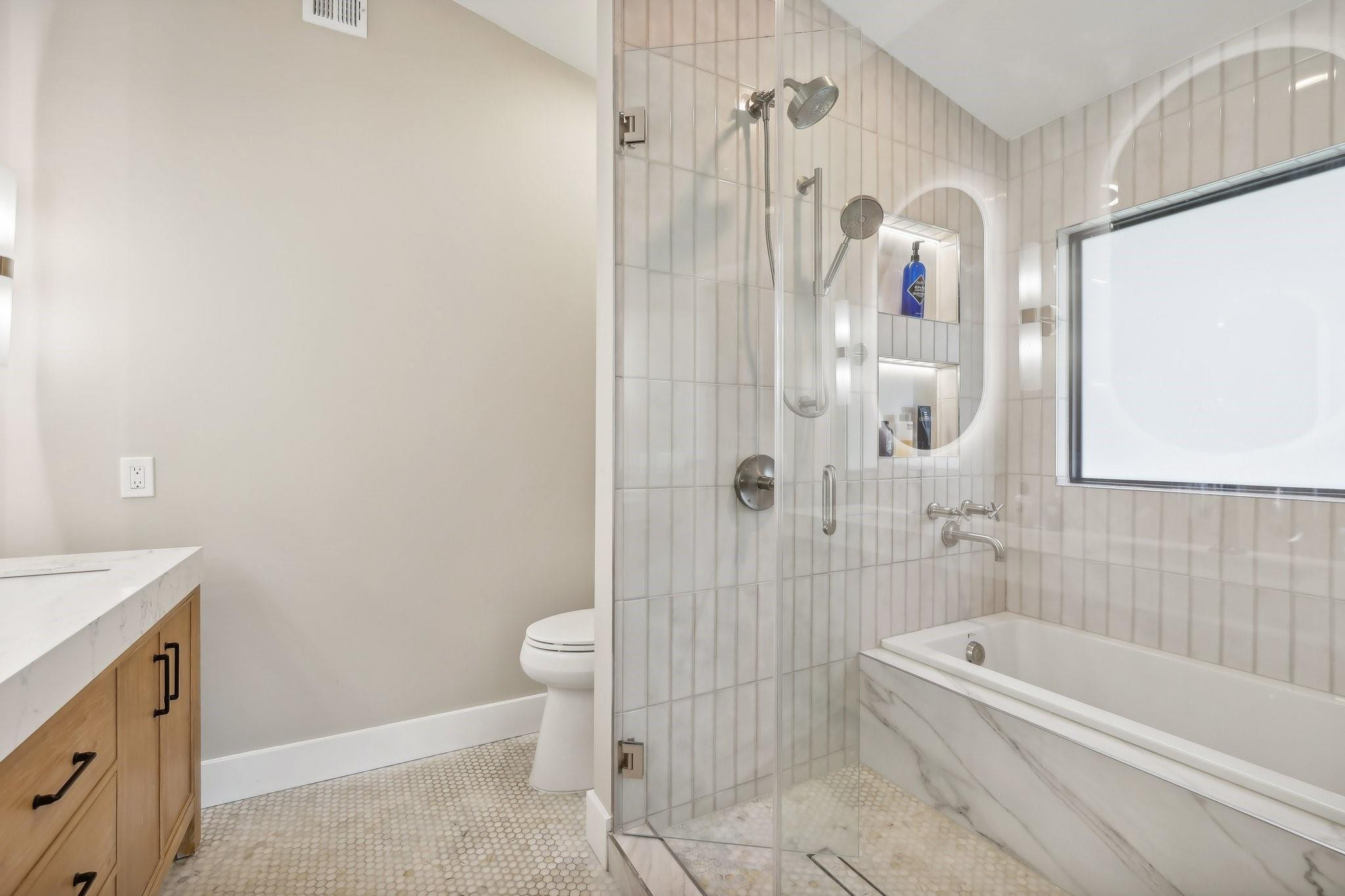 4035 Sabal Lakes Road Delray Beach, FL 33445 - Photo 24 of 43 a bathroom with a granite countertop bathtub shower sink vanity and toilet