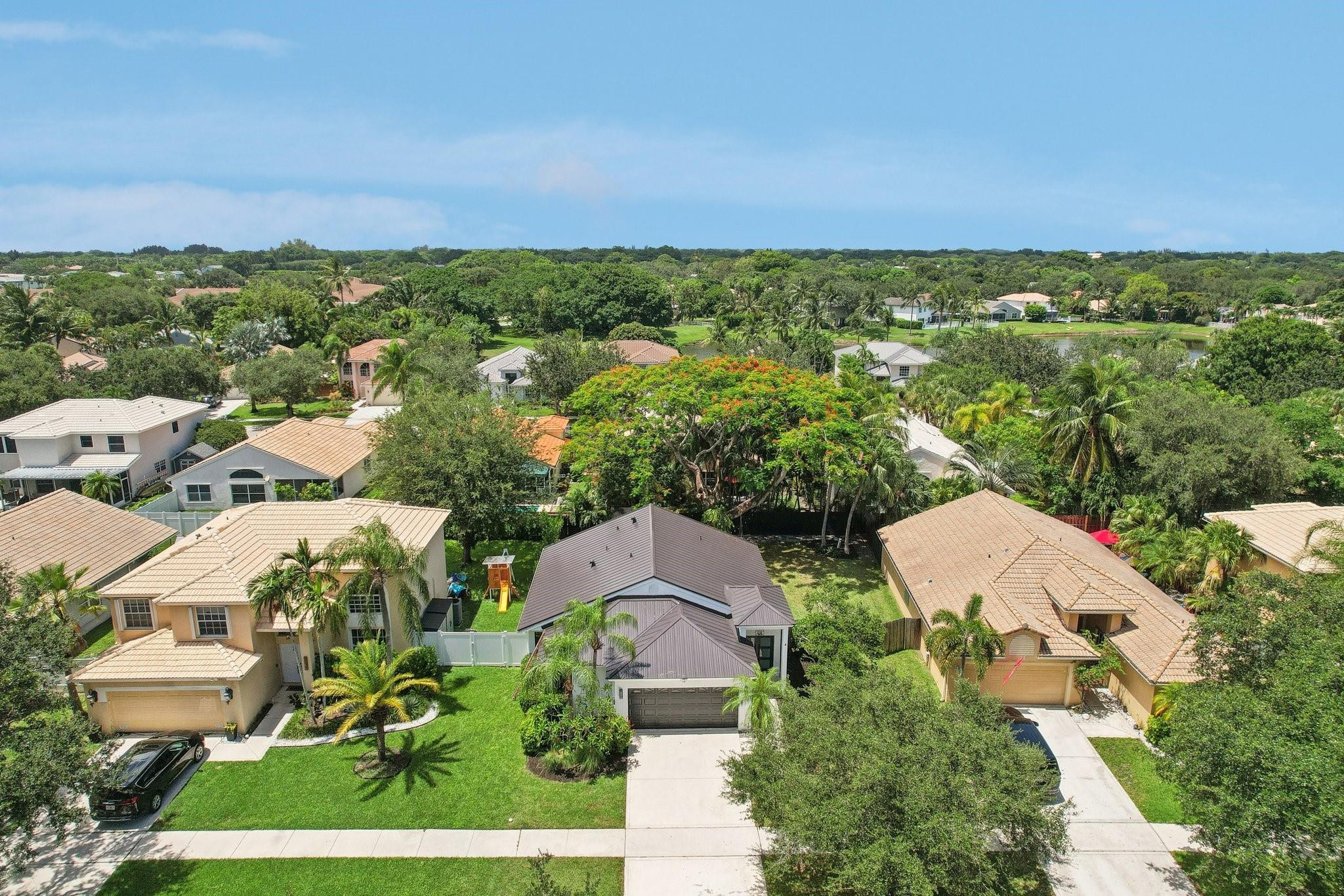 4035 Sabal Lakes Road Delray Beach, FL 33445 - Photo 36 of 43 an aerial view of multiple house