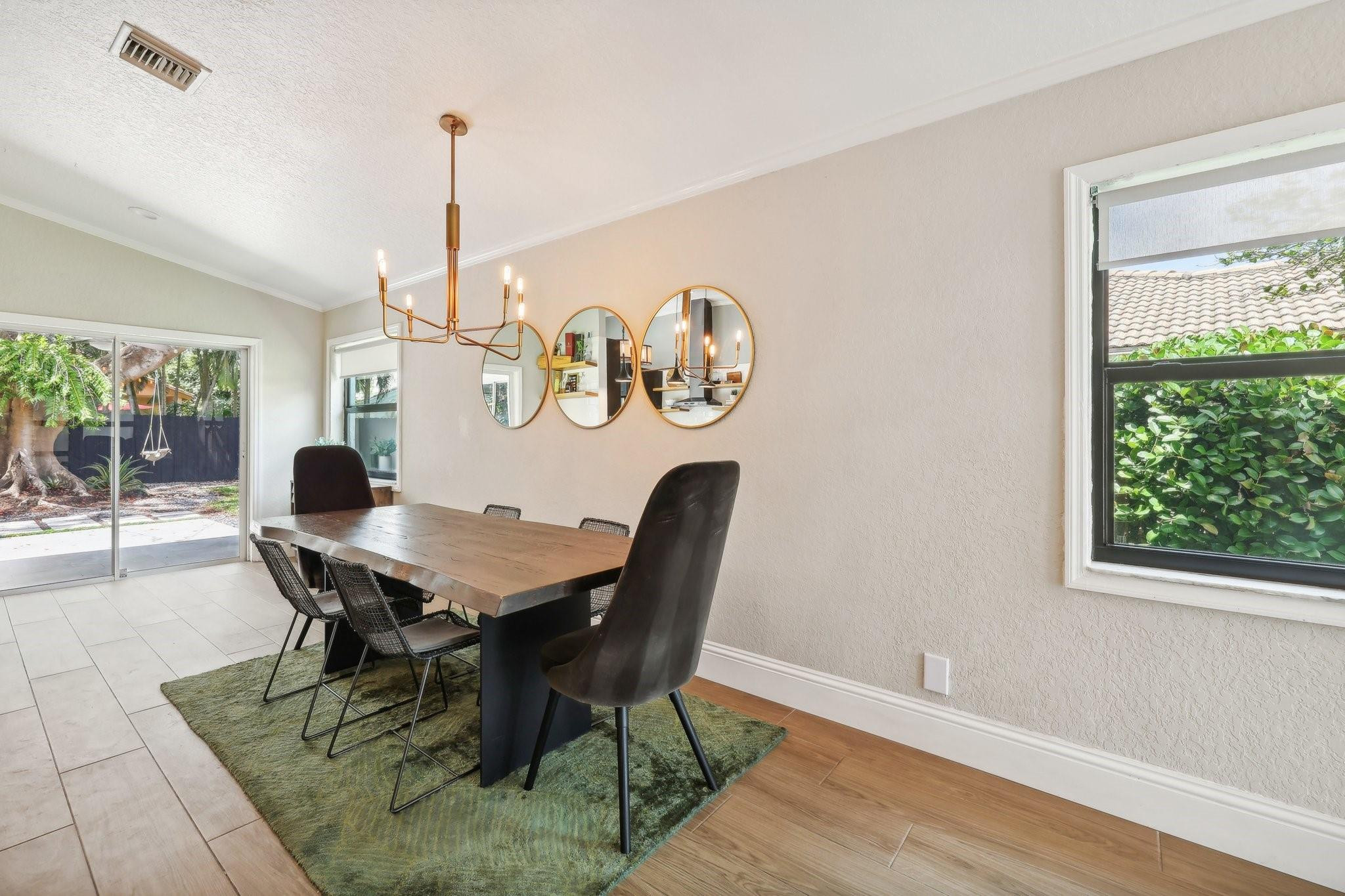 4035 Sabal Lakes Road Delray Beach, FL 33445 - Photo 10 of 43 a view of a dining room with furniture window and outside view
