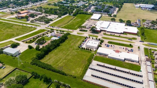 an aerial view of a swimming pool with a view of city