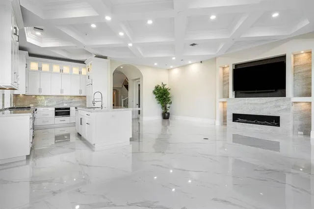 a large bedroom with a bed and glass window