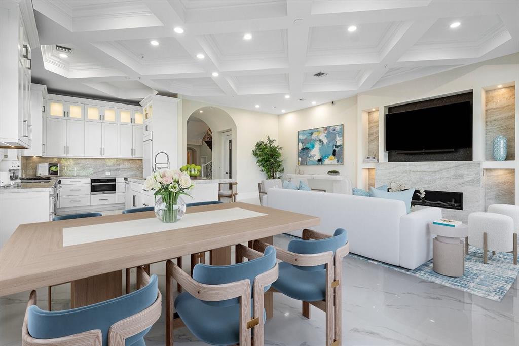 549 Northeast 19th Avenue, Unit C Deerfield Beach, FL 33441 - Photo 14 of 79 a living room with furniture a flat screen tv and kitchen view