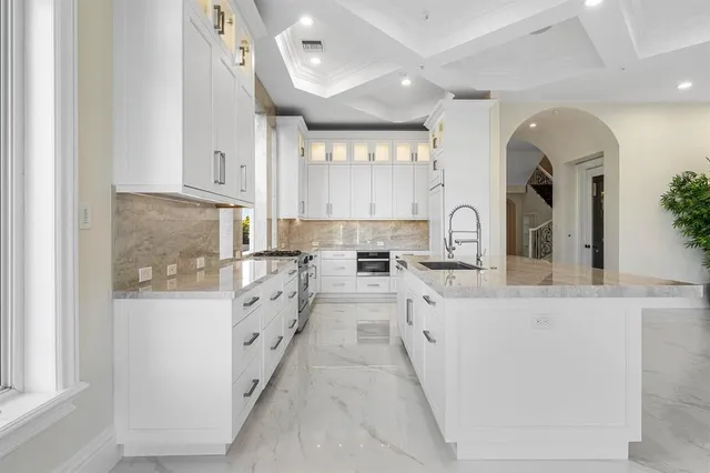 a balcony with furniture and a potted plant