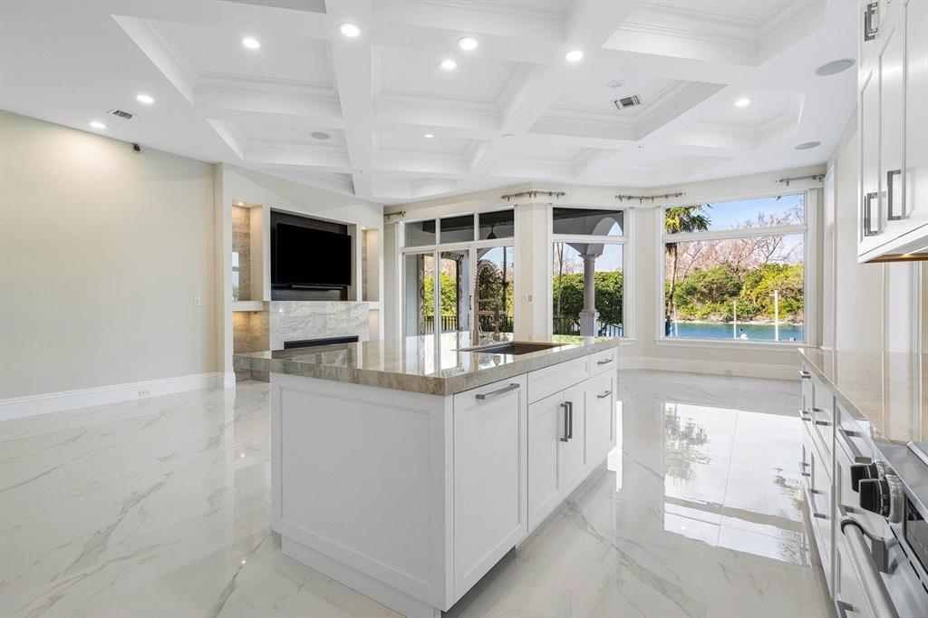 549 Northeast 19th Avenue, Unit C Deerfield Beach, FL 33441 - Photo 16 of 79 a kitchen with stainless steel appliances granite countertop a stove and a sink