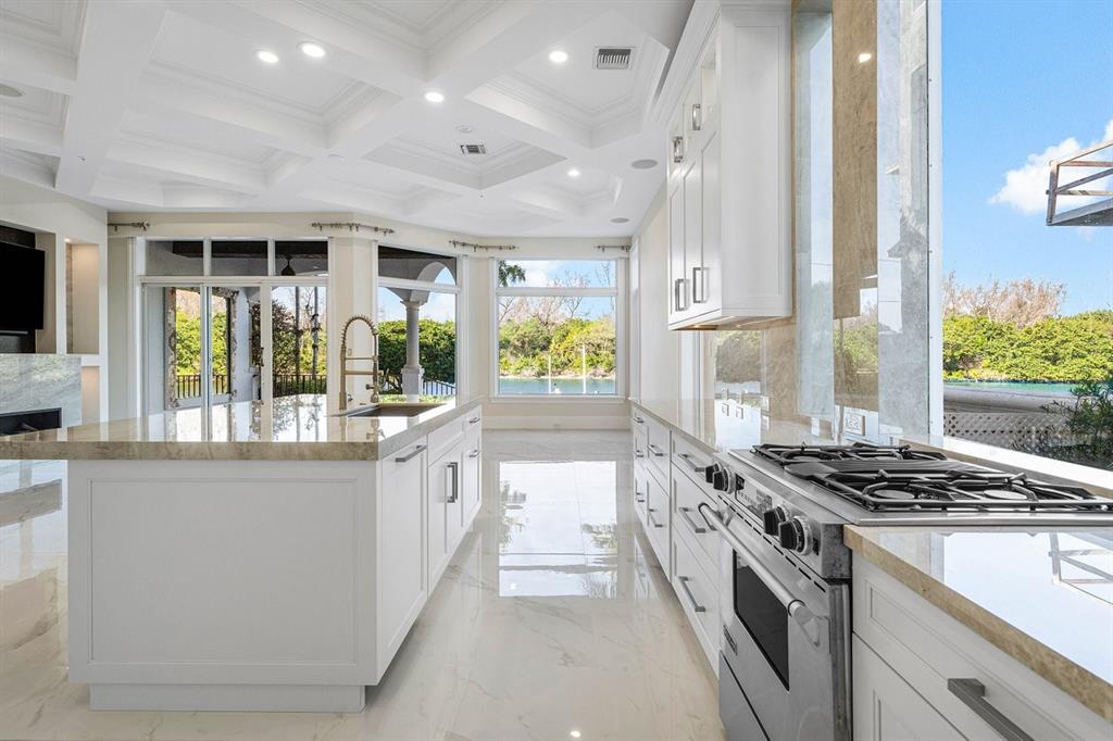 549 Northeast 19th Avenue, Unit C Deerfield Beach, FL 33441 - Photo 17 of 79 a kitchen with stainless steel appliances granite countertop a stove and a refrigerator