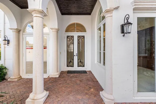 a view of living room filled with furniture and window