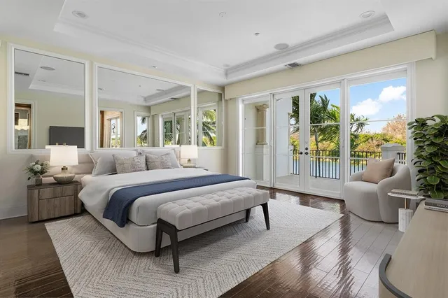 a bedroom with a bed and a potted plant