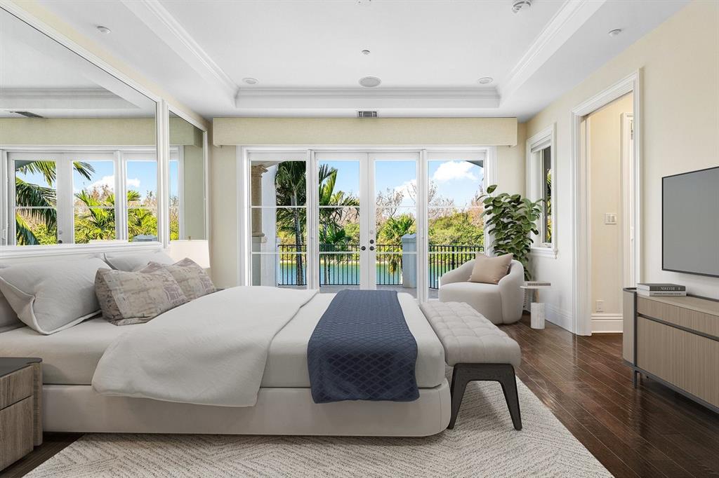 549 Northeast 19th Avenue, Unit C Deerfield Beach, FL 33441 - Photo 25 of 79 a large bedroom with a bed and glass window