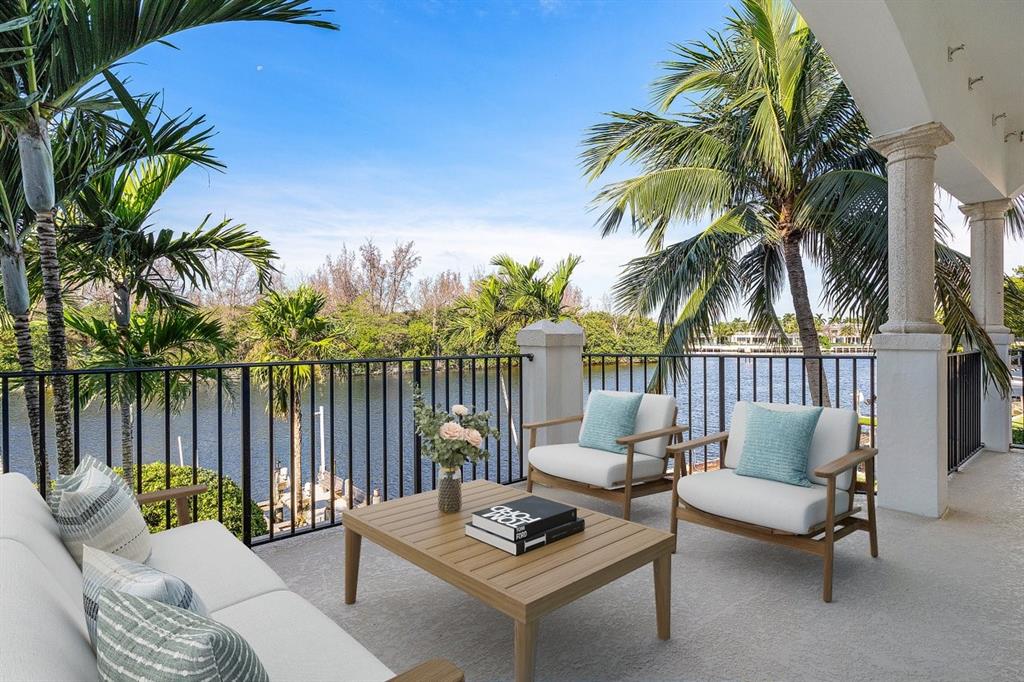 549 Northeast 19th Avenue, Unit C Deerfield Beach, FL 33441 - Photo 30 of 79 a balcony with furniture and a potted plant