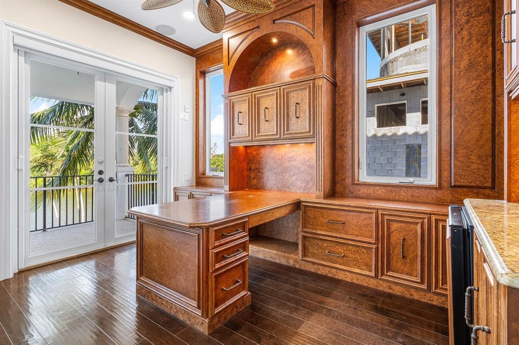 549 Northeast 19th Avenue, Unit C Deerfield Beach, FL 33441 - Photo 32 of 79 a kitchen with stainless steel appliances granite countertop a stove and a wooden floors