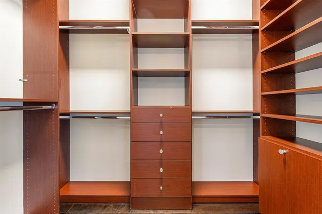 a front view of a house with yard and glass windows