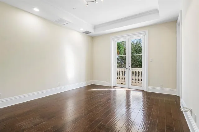 an aerial view of a house with a yard and lake view
