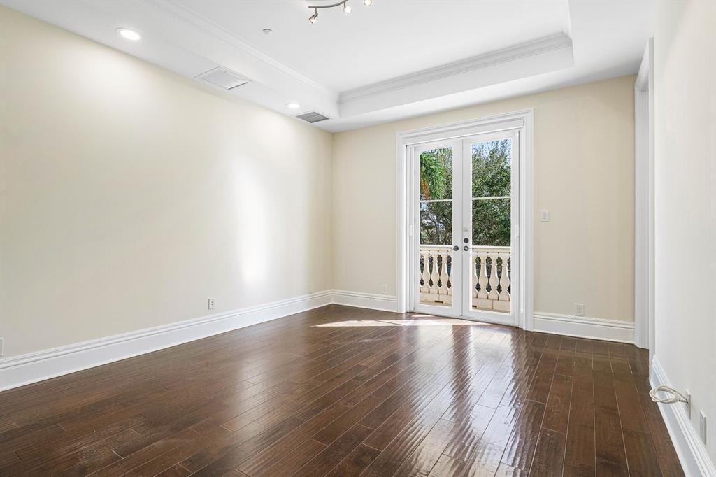 549 Northeast 19th Avenue, Unit C Deerfield Beach, FL 33441 - Photo 36 of 79 a view of an empty room with a window and wooden floor