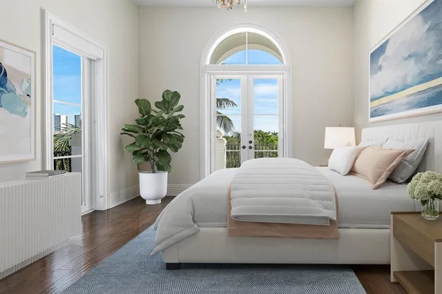 an aerial view of a house with a garden and lake view