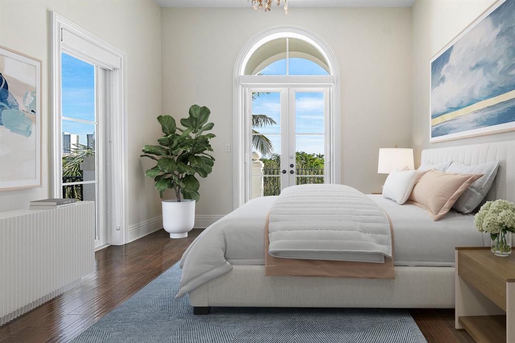 549 Northeast 19th Avenue, Unit C Deerfield Beach, FL 33441 - Photo 40 of 79 a bedroom with a bed and a potted plant